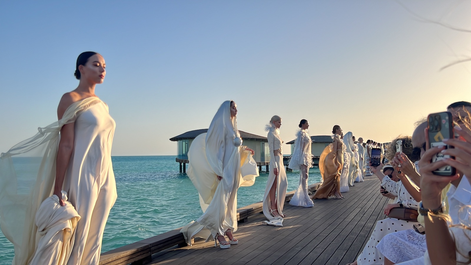 Embroidered white gowns incorporating delicate beadwork and sequins on sumptuous fabrics such as elevated fishnet and satin were subtly nods to the softness of waves and prominence of fishing culture on the coast. (Arab News)