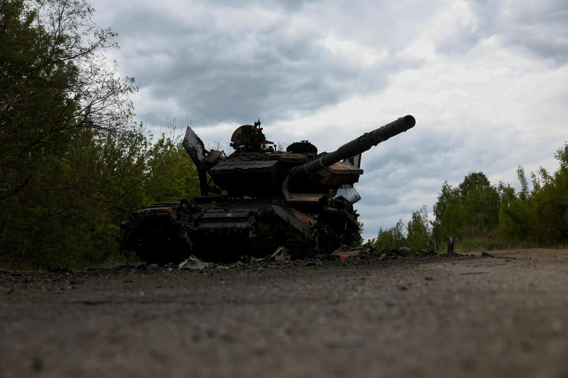 A destroyed tank is seen on a road in Kharkiv Region on May 16, 2024. (Reuters)