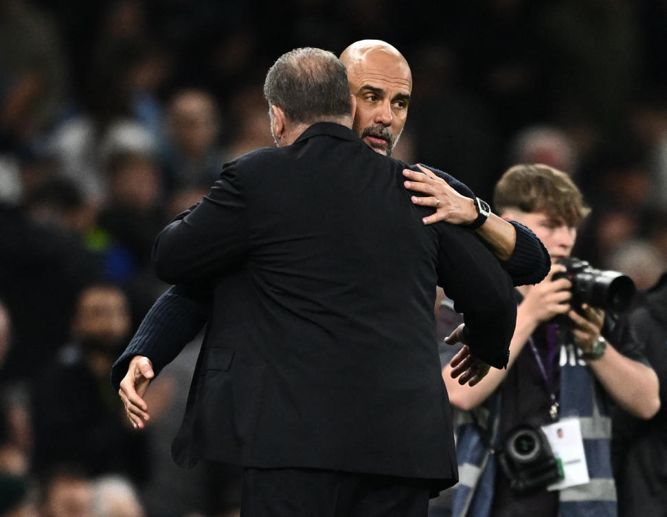 Tottenham Hotspur manager Ange Postecoglou and Manchester City manager Pep Guardiola after their Premier League match at Tottenham Hotspur Stadium, on May 14, 2024. (Reuters)