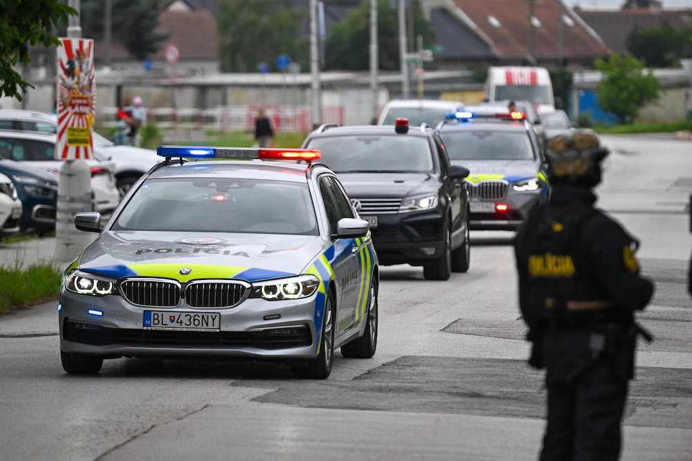 A convoy believed to carrying shooting suspect Juraj C arrives for an interrogation at the Specialized Criminal Court in Pezinok, north of Bratislava, Slovakia on May 18, 2024. (AFP)