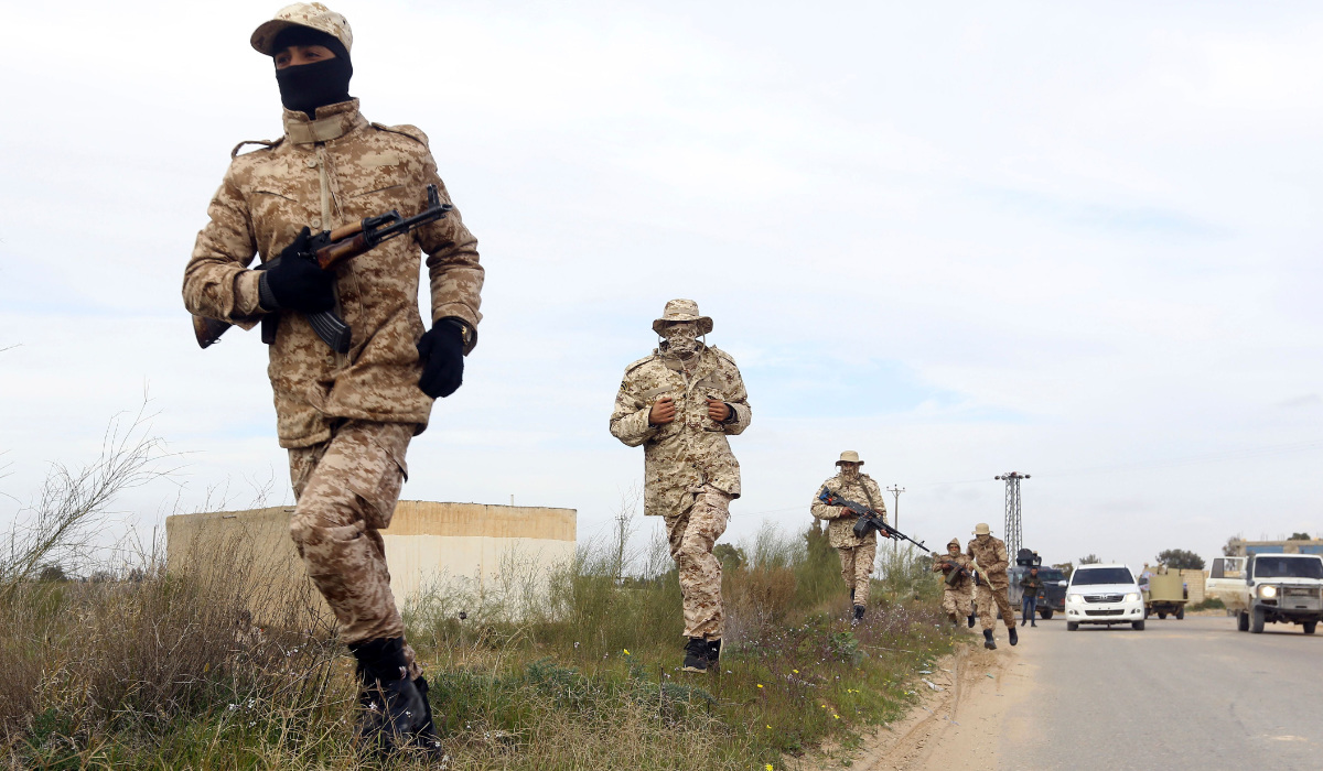 Members of the Tripoli Protection Force, an alliance of militias from the capital city, patrol an area south of the Libyan capital on January 18, 2019, during clashes with the Seventh Brigade group from the town of Tarhuna. (AFP)