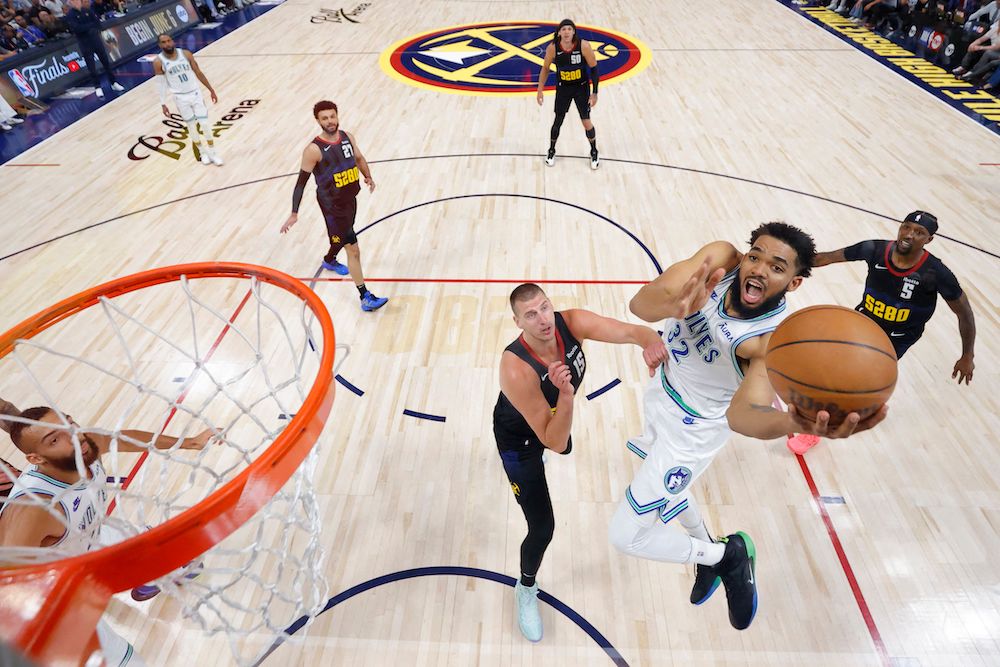 Karl-Anthony Towns of the Minnesota Timberwolves shoots the ball against Nikola Jokic of the Denver Nuggets during their Western Conference semifinal playoffs at Ball Arena on May 19, 2024 in Denver, Colorado. (Getty Images North America/AFP)