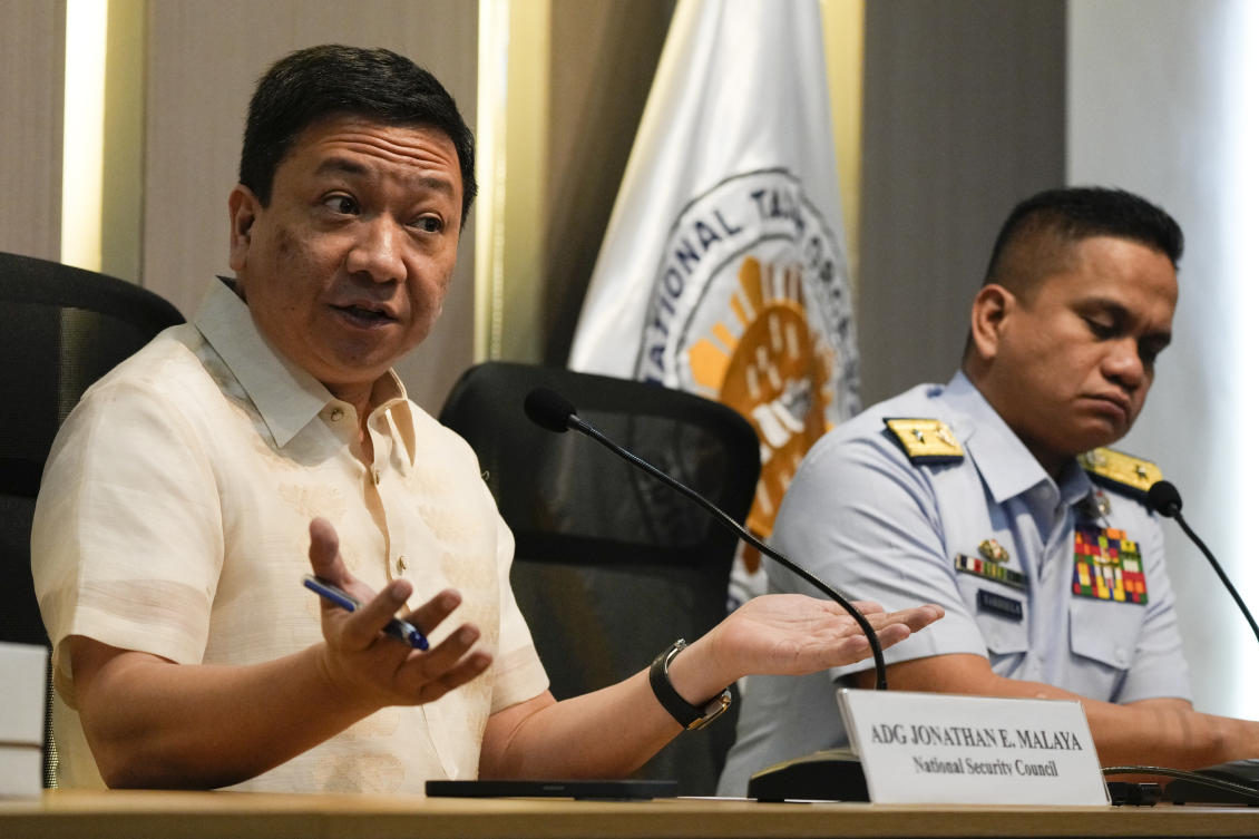 The Philippine coast guard presented surveillance photographs of Chinese fishermen harvesting large numbers of giant clams for a number of years in a lagoon at Scarborough Shoal. (AP photo)