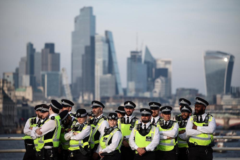 London’s High Court ruled on Tuesday that government exceeded its powers by unlawfully giving police wider powers to impose conditions on peaceful protests. (AFP)