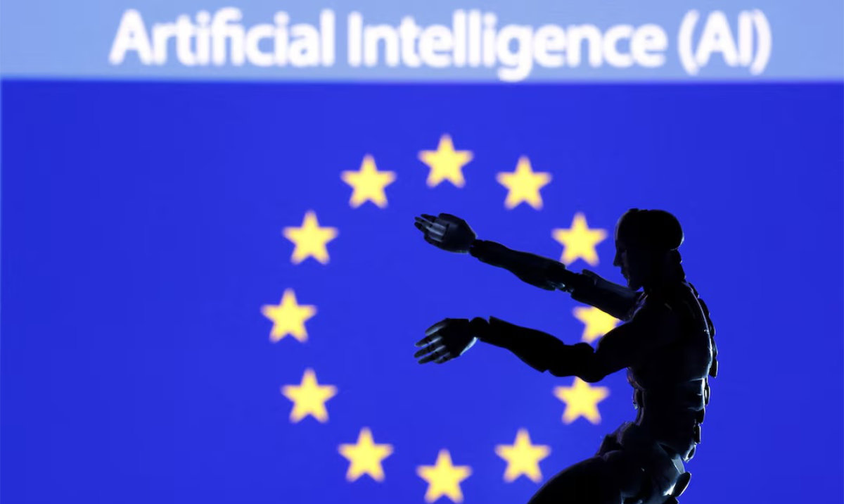 AI Artificial intelligence words, miniature of robot and EU flag are seen in this illustration. (Reuters/File)