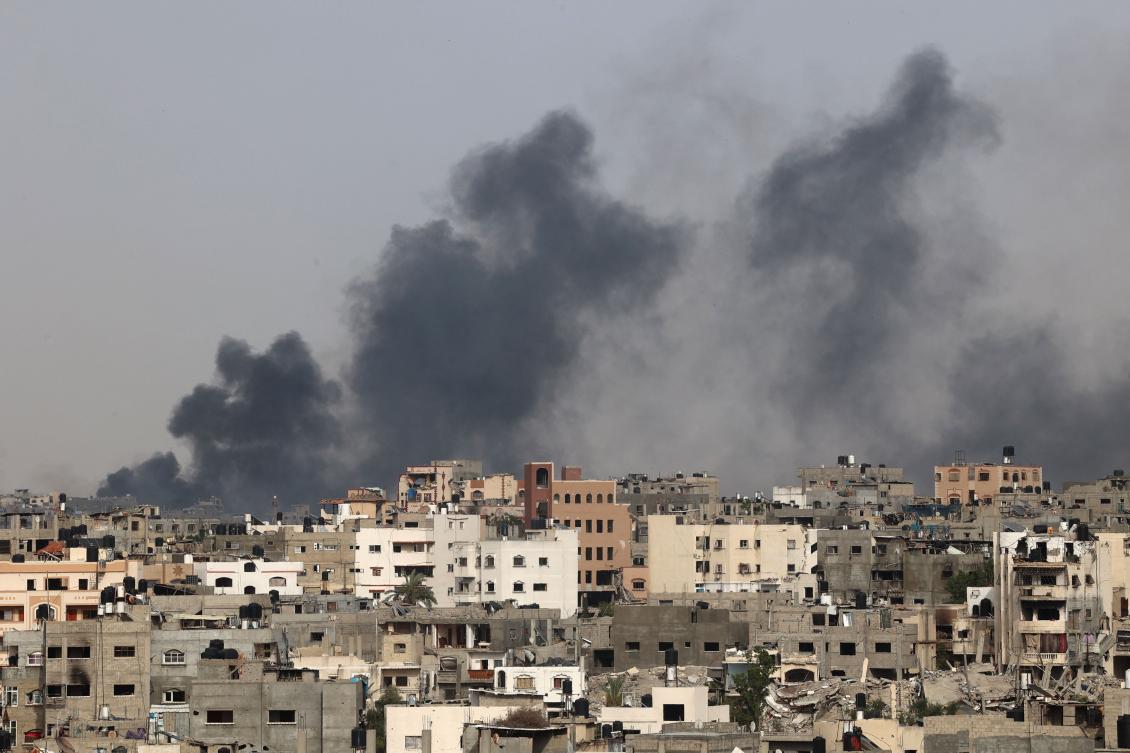 Smoke billows after an Israeli strike on Jabalia as seen from Beit Lahia, in the northern Gaza Strip on May 19, 2024. (AFP)