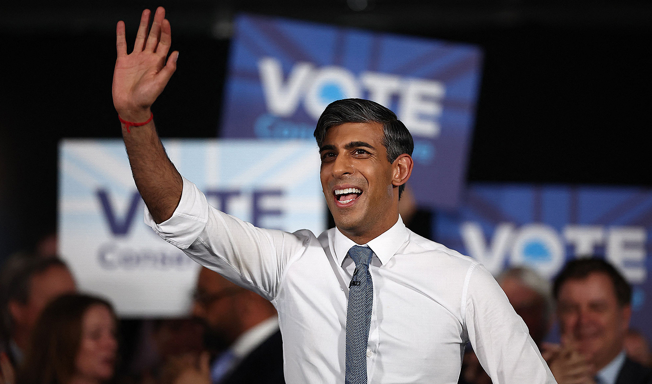 Britain’s Prime Minister and leader of the Conservative party, Rishi Sunak waves as he arrives to speak at a general election campaign event at the ExCeL in east London, on May 22, 2024. (AFP)