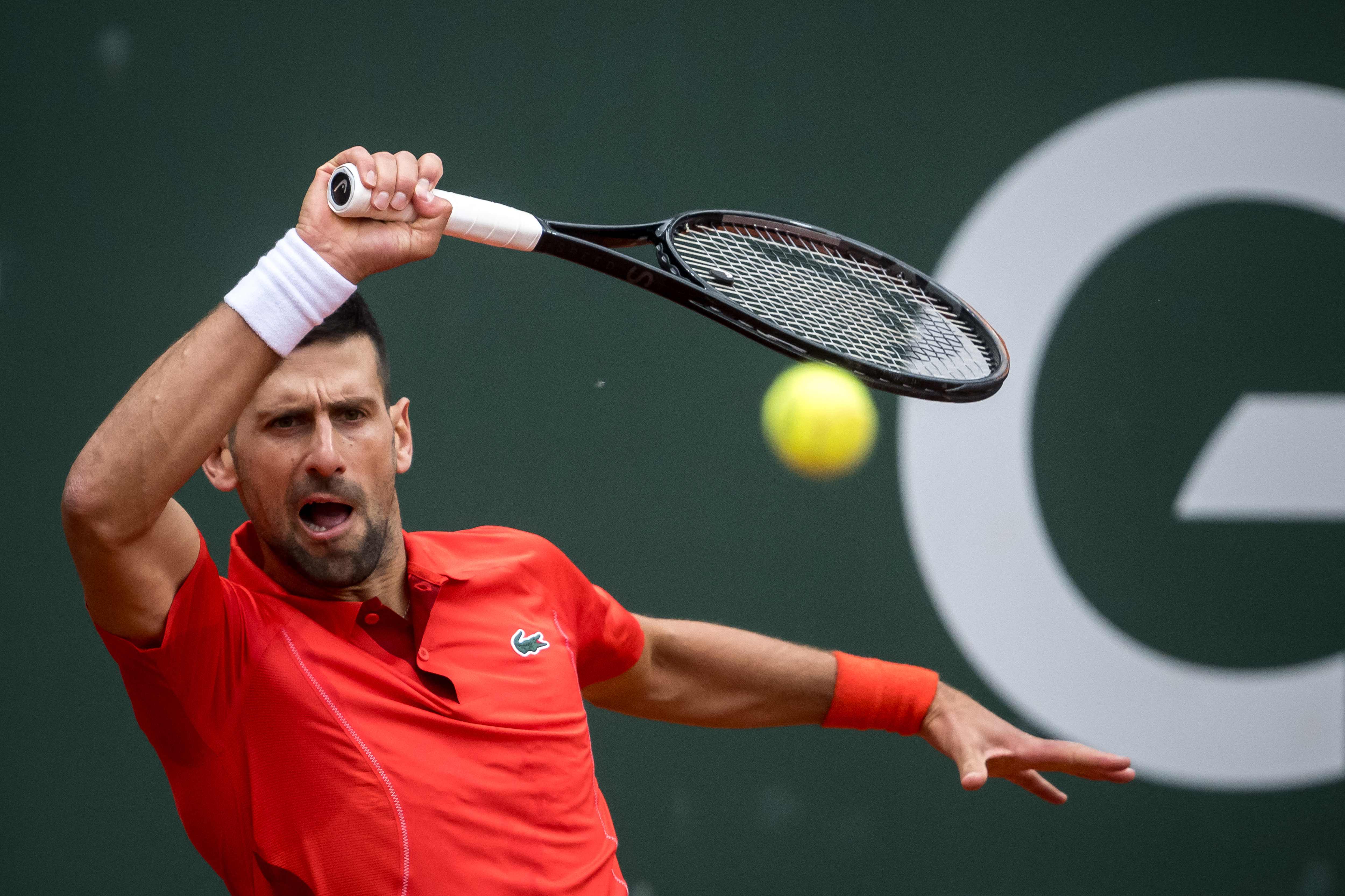 Serbia's Novak Djokovic plays a forehand return to Netherlands' Tallon Griekspoor during their ATP 250 Geneva Open tennis tournament single quarter final match, in Geneva on May 23, 2024. (AFP)