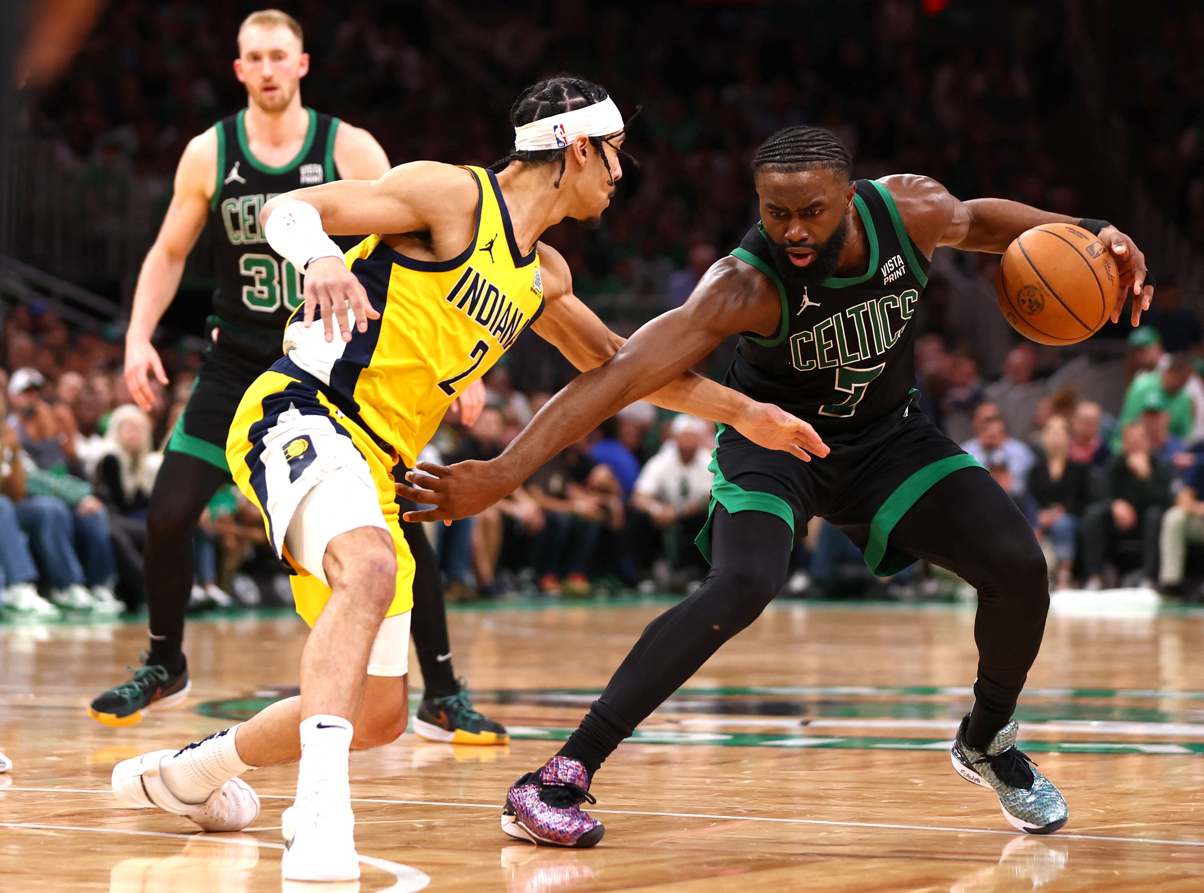 Jaylen Brown of the Boston Celtics drives past Andrew Nembhard of the Indiana Pacers during the fourth quarter in Game 2 of the Eastern Conference Finals at TD Garden. (GETTY IMAGES NORTH AMERICA/AFP)