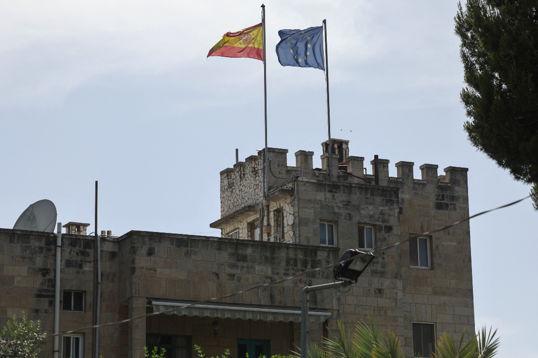 The Spanish and European Union flags flutter on the consulate of Spain building in the Sheikh Jarrah neighbourhood of Israeli-annexed east Jerusalem. (File/AFP)