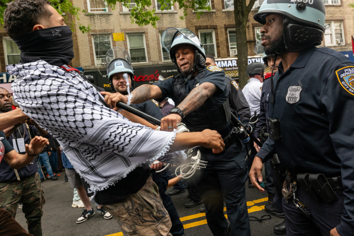 Pro-Palestinian protesters confront police during a Nakba Day rally and march on May 18, 2024 in the Bay Ridge section of New York City. (Getty Images via AFP)