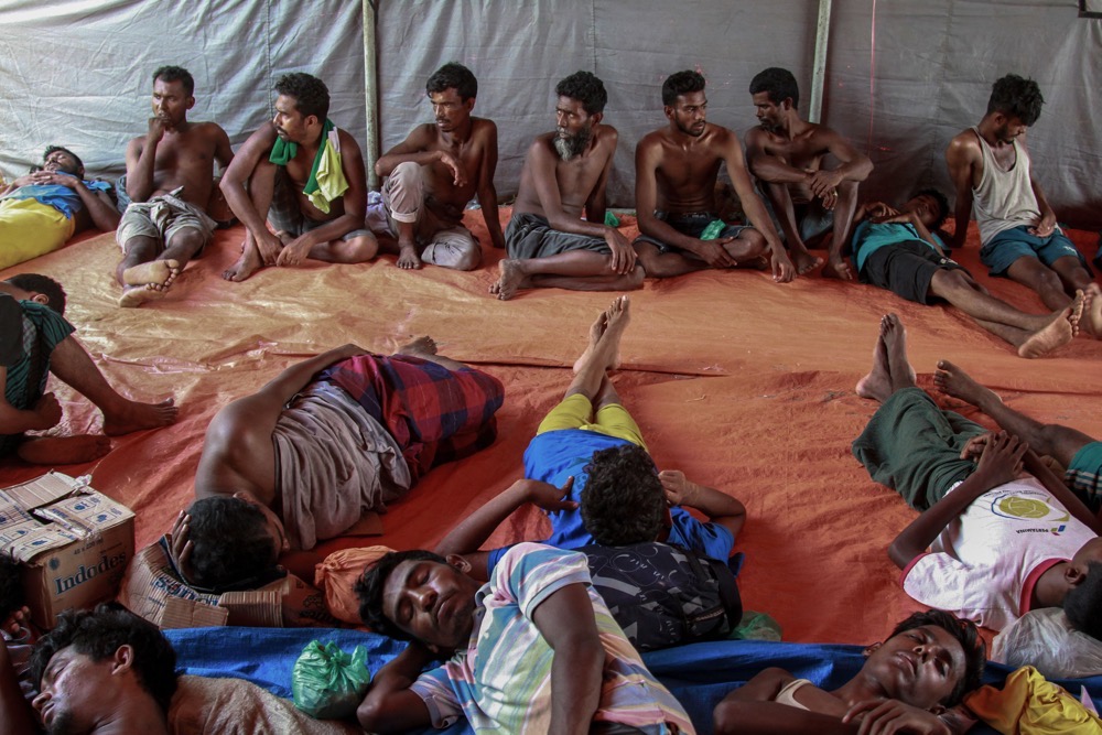 Rohingya refugees rest inside a tent in Kwala Langkat Village, in Langkat, North Sumatra. (AFP)