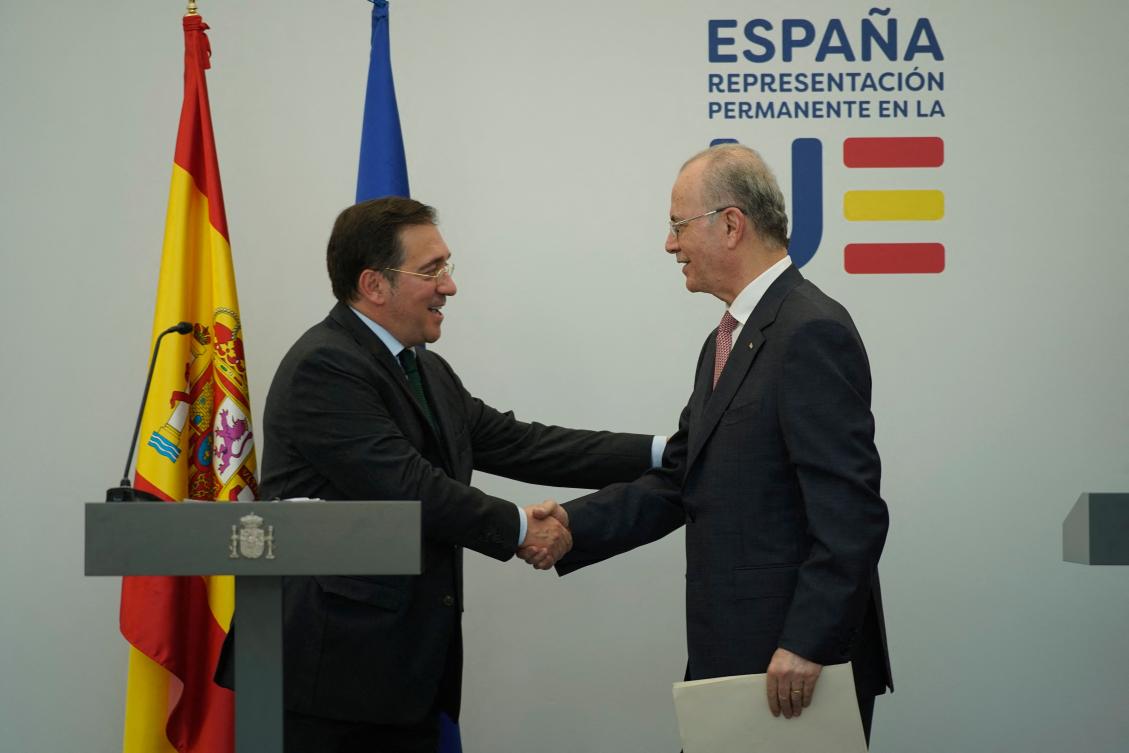 Spanish Minister for Foreign Affairs, European Union and Cooperation, Jose Manuel Albares (L) shakes hands with Palestinian Prime Minister Mohammad Mustafa (R) during their meeting at the the Permanent Representation of Spain to the European Union in Brussels, on May 26, 2024. (AFP)