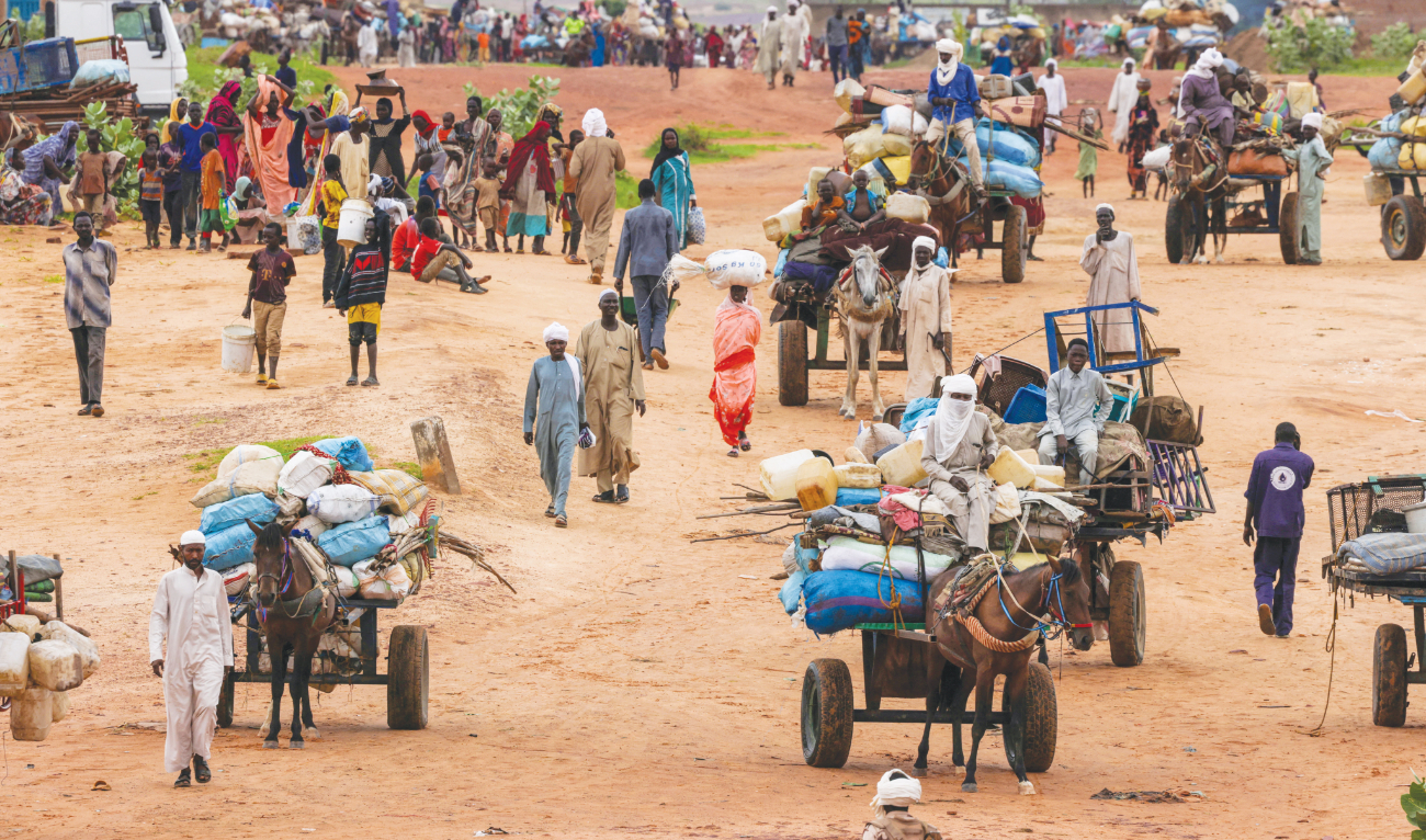 People fleeing the violence in West Darfur, cross the border into Adre, Chad. Sudan’s conflict has killed more than 14,000 people since April last year. (File/Reuters)