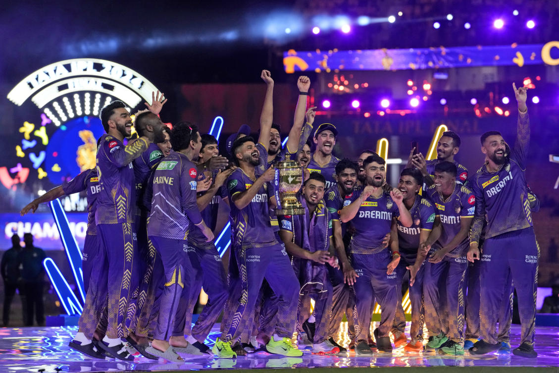 Kolkata Knight Riders players celebrate with the trophy after defeating Sunrisers Hyderabad during the IPL final match in Chennai. (AP)