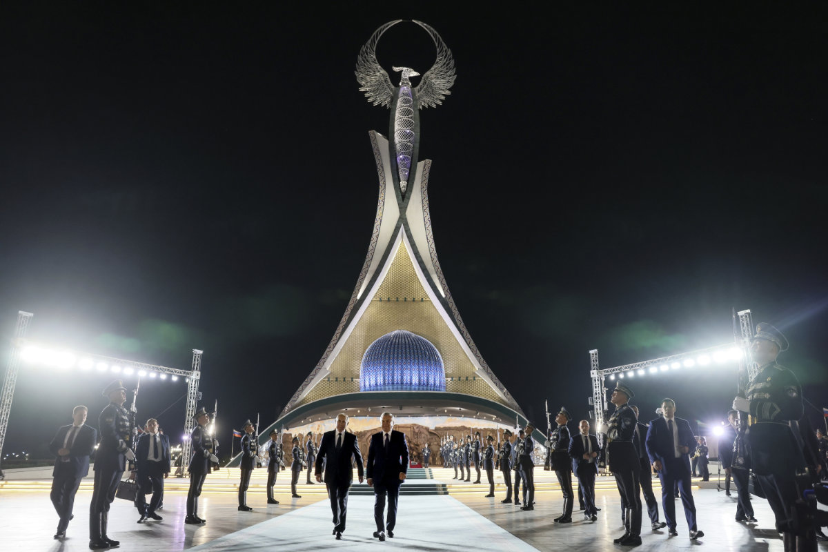 Russian President Vladimir Putin, left, and Uzbek President Shavkat Mirziyoyev visit Yangi O'zbekiston park during their meeting in Tashkent on May 26, 2024. (Sputnik, Kremlin Pool Photo via AP)