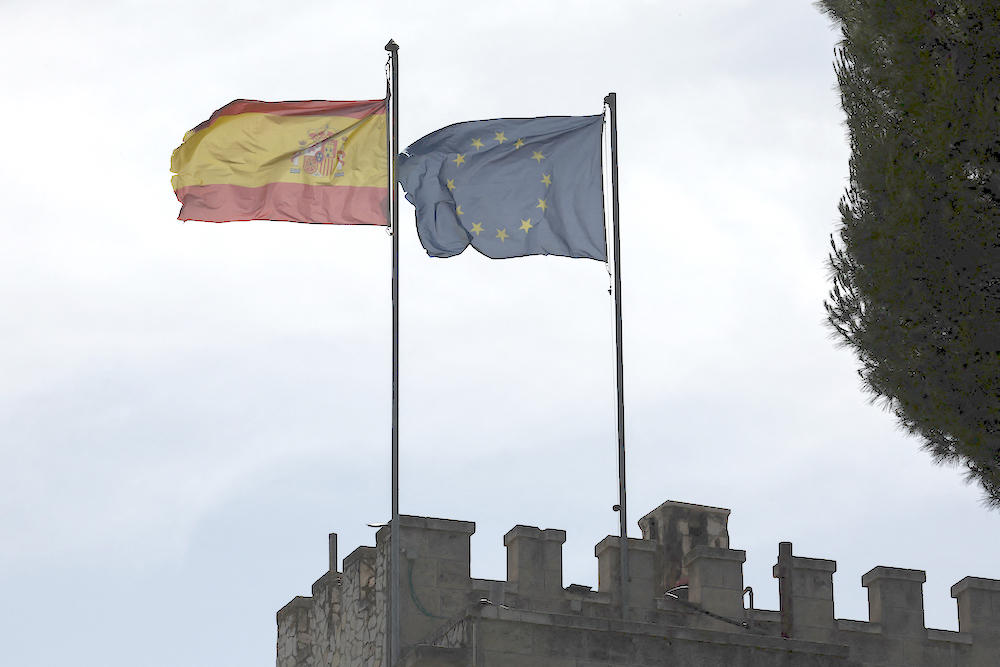 Above, the Spanish and European Union flags flutter on the Spanish consulate building in the Sheikh Jarrah neighborhood of east Jerusalem on May 22, 2024. (AFP)