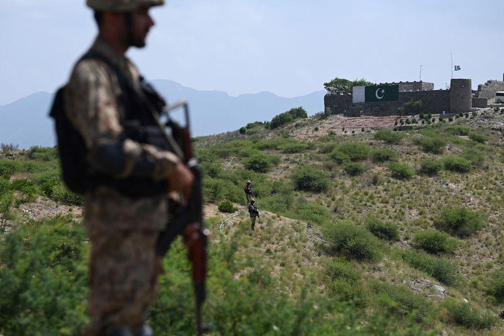 Above, Pakistani troops patrol along Pakistan-Afghanistan border at Big Ben post in the Khyber district of the Khyber Pakhtunkhwa province. (AFP file photo)