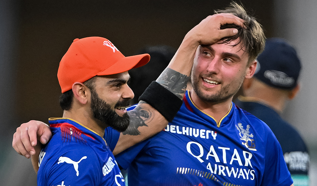 Royal Challengers Bengaluru’s Virat Kohli and Will Jacks (R) celebrate after their team’s win in the Indian Premier League (IPL) Twenty20 cricket match between Gujarat Titans and Royal Challengers Bengaluru at the Narendra Modi Stadium in Ahmedabad on April 28, 2024. (AFP)