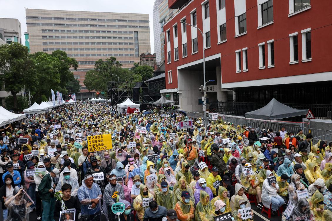 Protesters showed their anger at the reforms being passed, and also shouted ‘refuse Chinese political interference,’ among other slogans. (AFP)