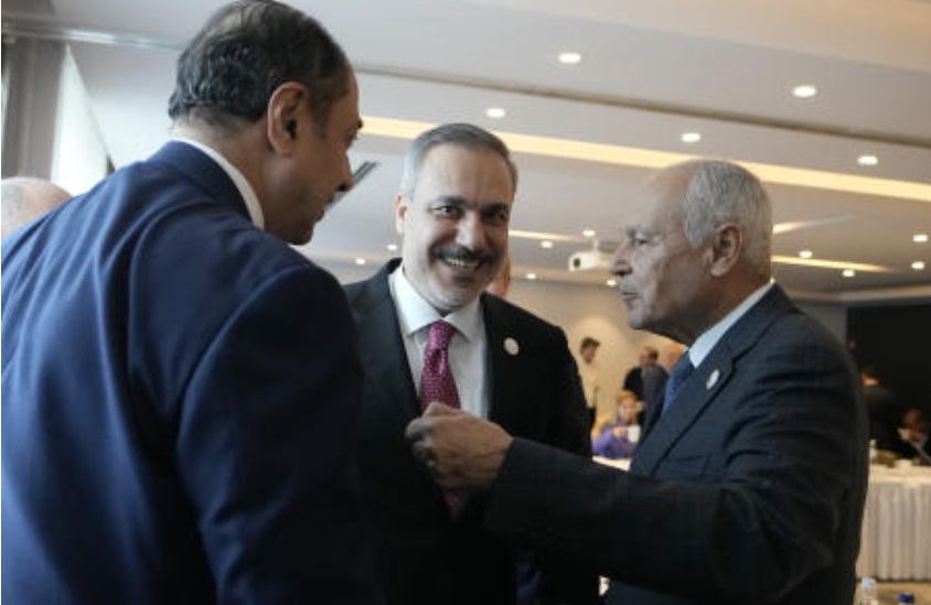 Ahmed Aboul Gheit Secretary General of the League of Arab States speaks with Turkiye’s Foreign Minister Hakan Fidan as they attend a meeting for talks on the Middle East in Brussels on May 26, 2024. (AP)