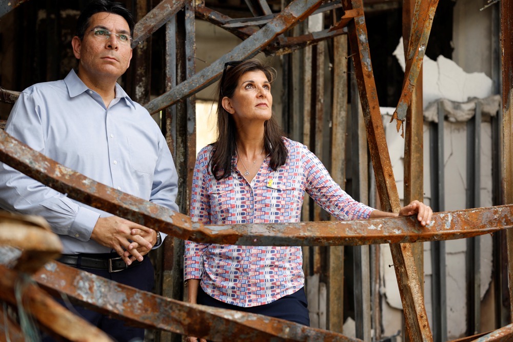 Former Republican presidential contender Nikki Haley and Israeli lawmaker Danny Danon tour Kibbutz Nir Oz, southern Israel. (Reuters)
