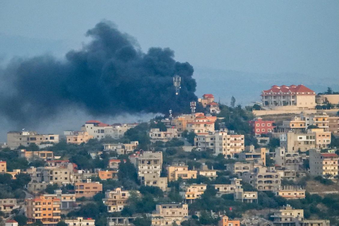 Smoke billows over the southern Lebanese village of Khiam near the border with Israel, following an Israeli airstrike on May 25, 2024. (AFP)