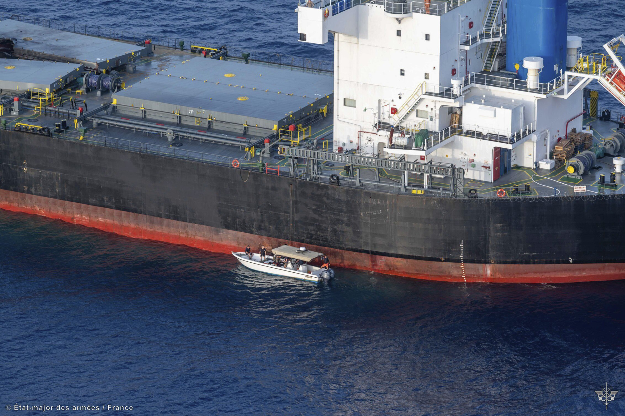 In this undated photo provided by the Etat Major des Armees on May 30, a view of the Laax, a Greek-owned, Marshall Islands-flagged bulk carrier that came under attack by Yemen's Houthi rebels earlier this week, carrying cargo of grain bound for Iran, the group's main benefactor. (Etat Major des Armees via AP)