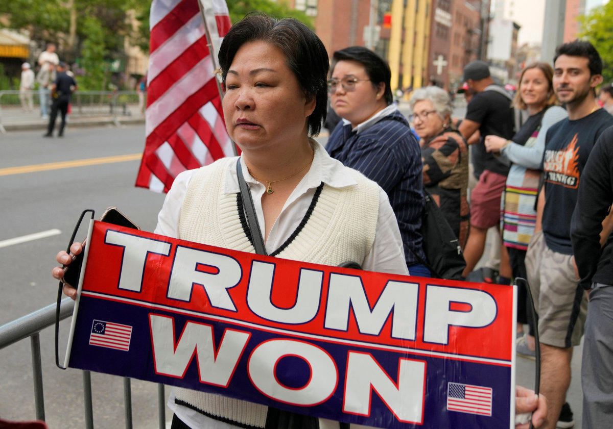A supporter of Republican presidential candidate and former US President Donald Trump reacts outside the Manhattan criminal court to hearing a verdict in Trump's criminal trial in New York City on May 30, 2024. (REUTERS)