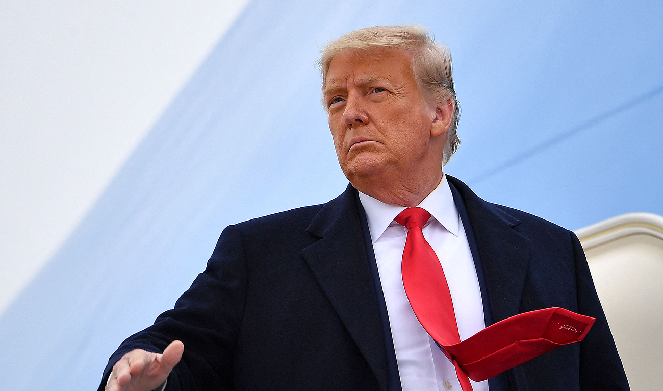 In this file photo, taken on January 12, 2021, former US President Donald Trump boards Air Force One before departing Harlingen, Texas. (AFP/File)