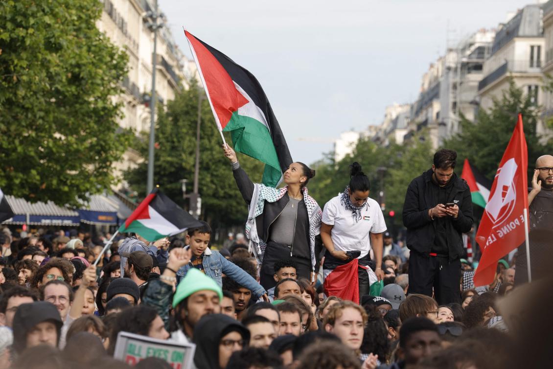 A person waves a Palestinian flag during a gathering at Republic square in Paris on May 28, 2024. (AFP)