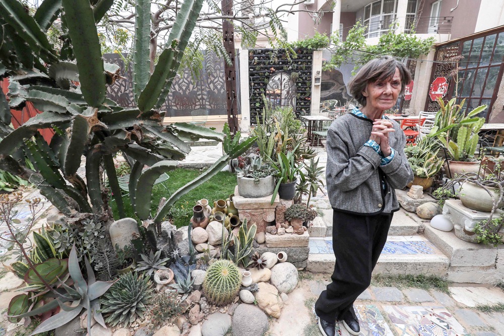 A woman visits the garden of Bayt Ali Gana in Tripoli. Libyan artist Ali Gana’s family has turned his house into a unique museum, which opened this year. (AFP)
