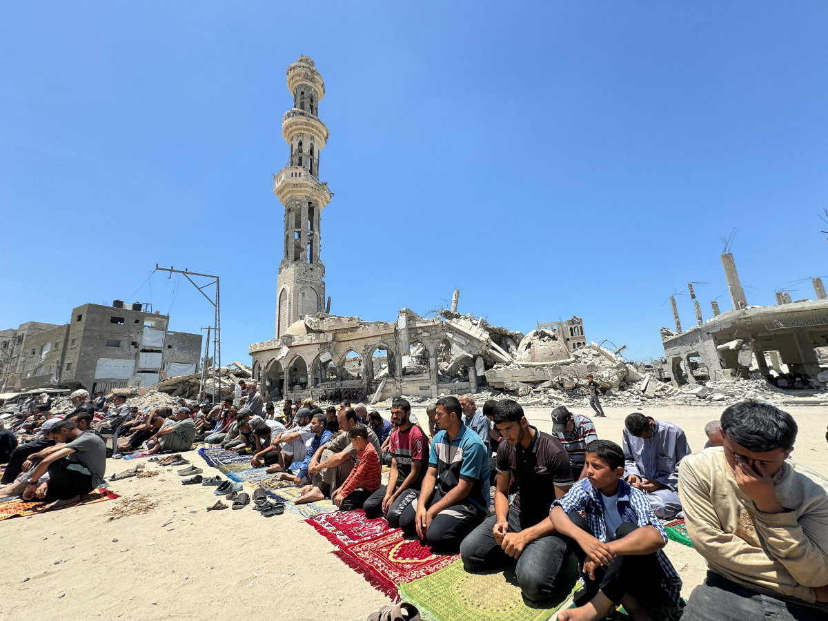 Palestinians perform Friday prayers at the ruins of a mosque destroyed in the Israeli military offensive in Khan Younis, southern Gaza Strip, on May 31, 2024. (REUTERS)