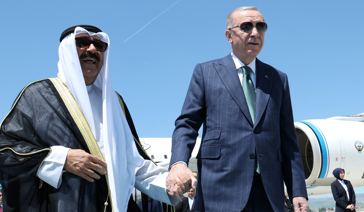 Turkey's President Tayyip Erdogan welcomes Kuwait's Emir Sheik Meshal Al-Ahmad Al-Sabah upon his arrival in Ankara. (REUTERS)