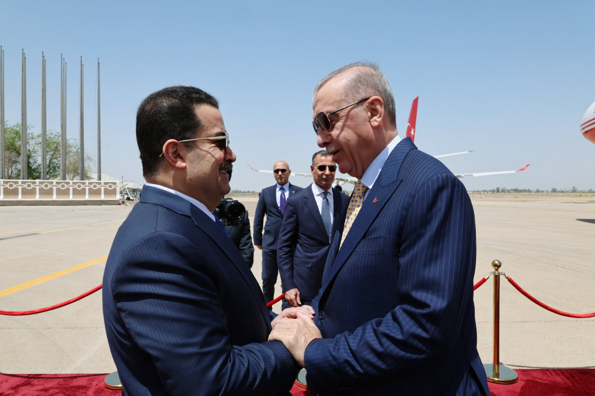 Turkish President Recep Tayyip Erdogan is welcomed by Iraq's PM Mohammed Shia Al-Sudani (L) in Baghdad on April 22, 2024. (AFP)