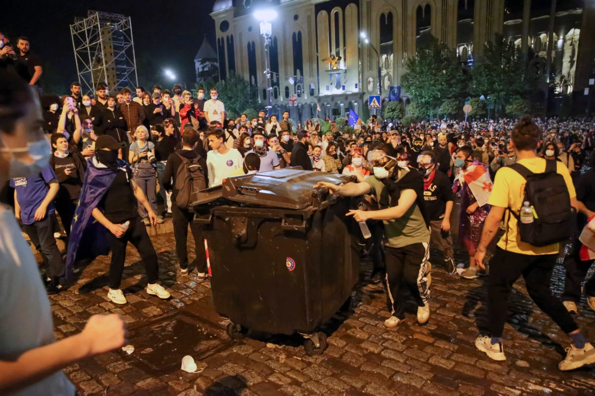 Demonstrators build a barricade during an opposition protest against "the Russian law" near the Parliament building in Tbilisi, Georgia, early on May 2, 2024. (AP Photo)
