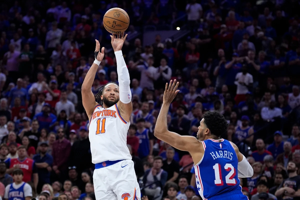 New York Knicks' Jalen Brunson goes up to shoot against Philadelphia 76ers' Tobias Harris during the first half of Game 6 in an NBA basketball first-round playoff series, Thursday in Philadelphia. (AP)