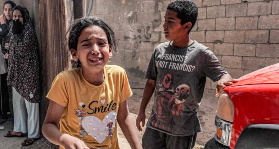 Children react as they flee following Israeli bombardment in Nuseirat in the central Gaza Strip on April 29, 2024, amid the ongoing conflict in the Palestinian territory between Israel and the militant group Hamas. (AFP)