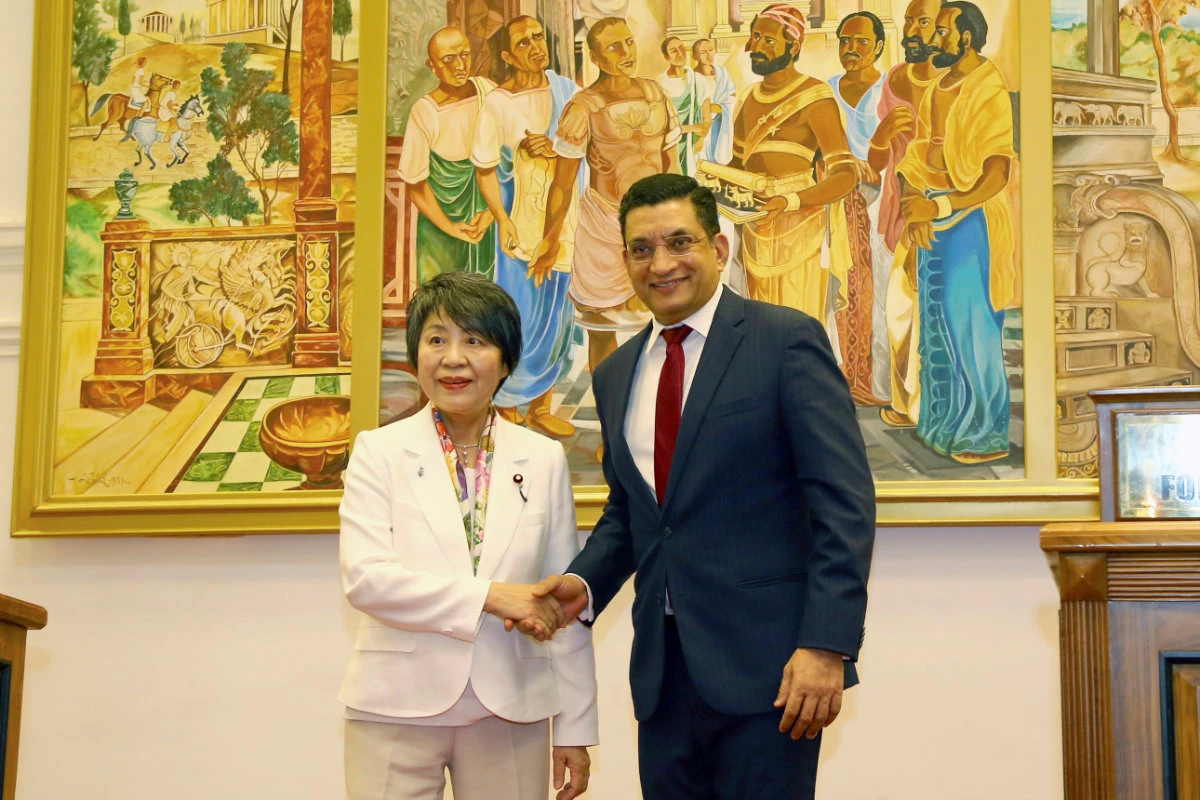 Yoko Kamikawa, Japan's minister of foreign affairs, left, and her Sri Lankan counterpart Ali Sabri, shake hands at a meeting in Colombo, Sri Lanka, on May 4, 2024. (AP Photo)