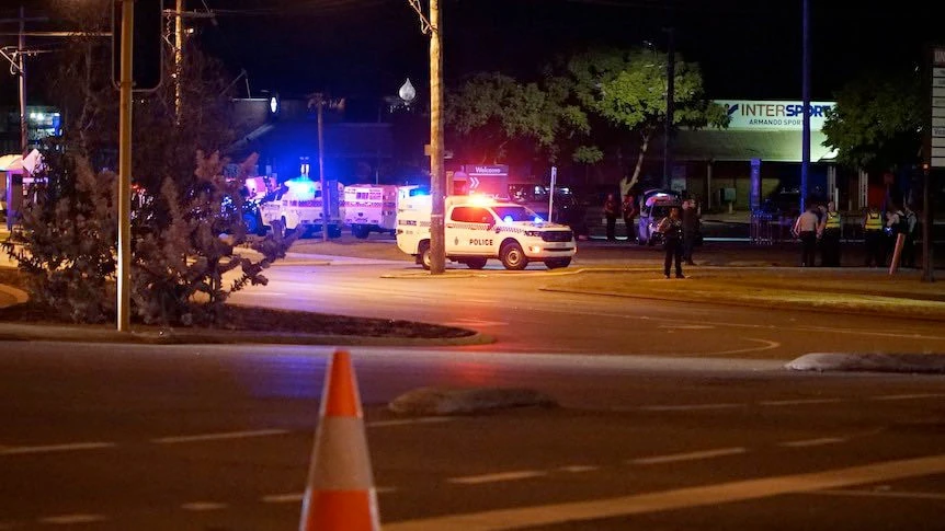 A photo widely shared on social media shows police securing the perimeter of the site of a stabbing attack in the suburb of Willetton in Perth, Australia, on Sunday. (Social media photo)