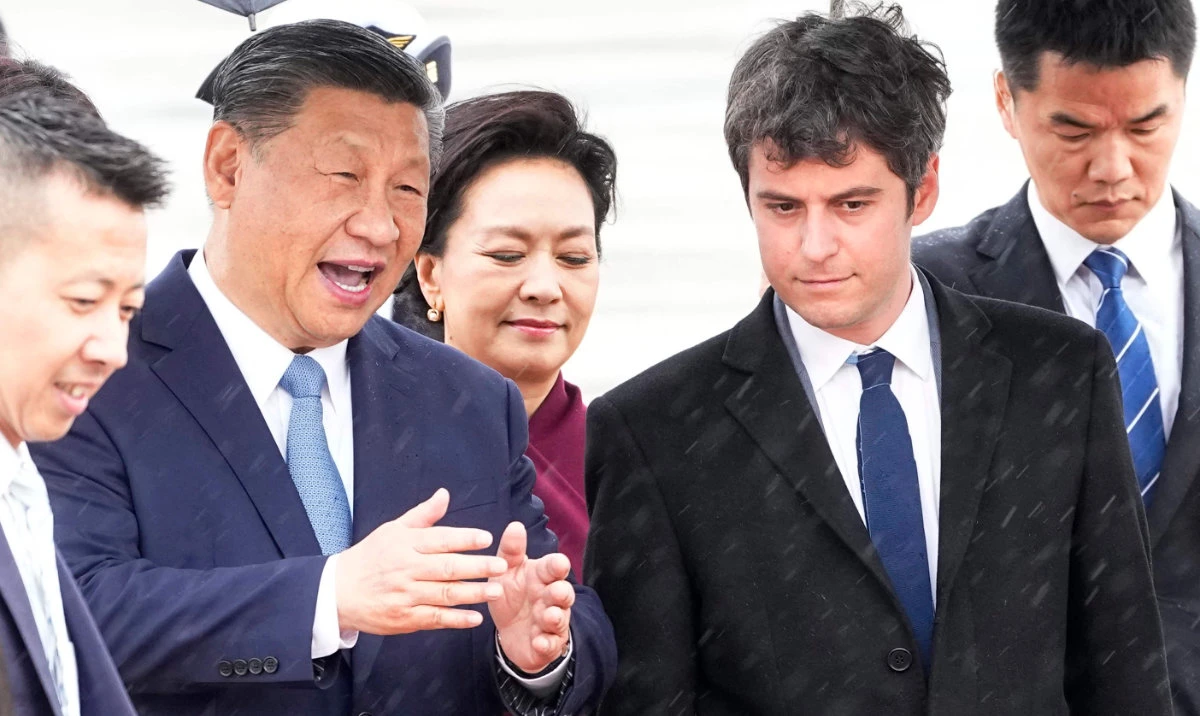 France's Prime Minister Gabriel Attal greets China's President Xi Jinping and his wife Peng Liyuan upon their arrival for an official two-day state visit, at Orly airport, south of Paris on May 5, 2024. (AFP)