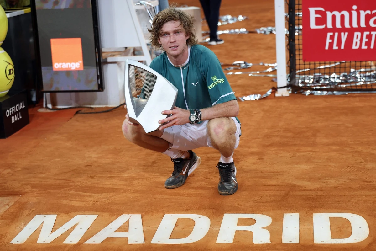 Russia's Andrey Rublev with th trophy after beating Canada's Felix Auger-Aliassime in the 2024 ATP Tour Madrid Open tournament singles final tennis match at Caja Magica in Madrid on May 5, 2024. (AFP)