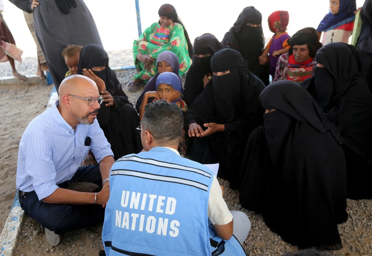 United Nations Office for the Coordination of Humanitarian Affairs (OCHA)'s Markus Werne (L) visits a camp for internally displaced people in Yemen's Khokha district, south of Hodeida, on April 29, 2024.(AFP)