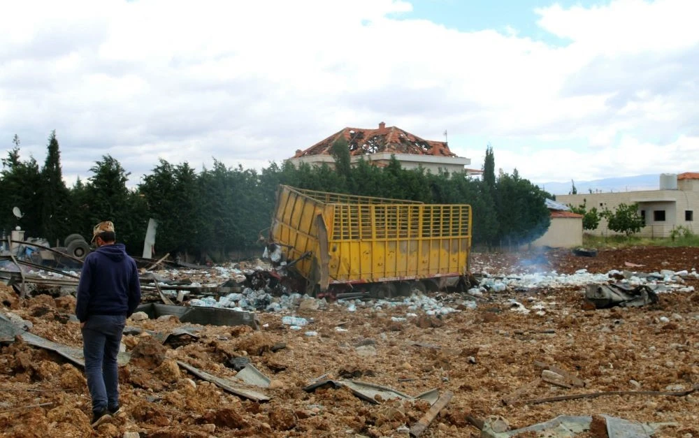 A man inspects the scene of an overnight Israeli air strike that targeted an area near the Bekaa Valley city of Baalbek, around 80 kilometers from the Israel-Lebanon frontier, on May 6, 2024. (AFP)