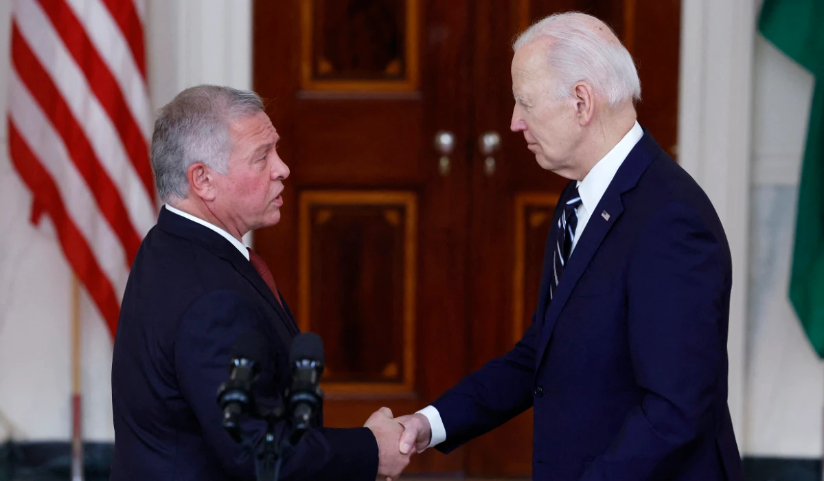 US President Joe Biden (R) shakes hands with King of Jordan Abdullah II ibn Al Hussein after delivering remarks to members of the media at the White House on February 12, 2024 in Washington, DC. (AFP)