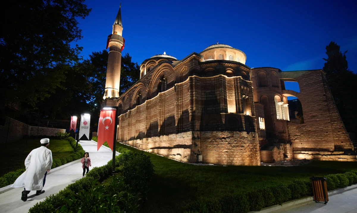 A Muslim cleric walks along a former Byzantine church which formally opened as a mosque, in Istanbul, Turkey, Monday, May 6, 2024. (AP)