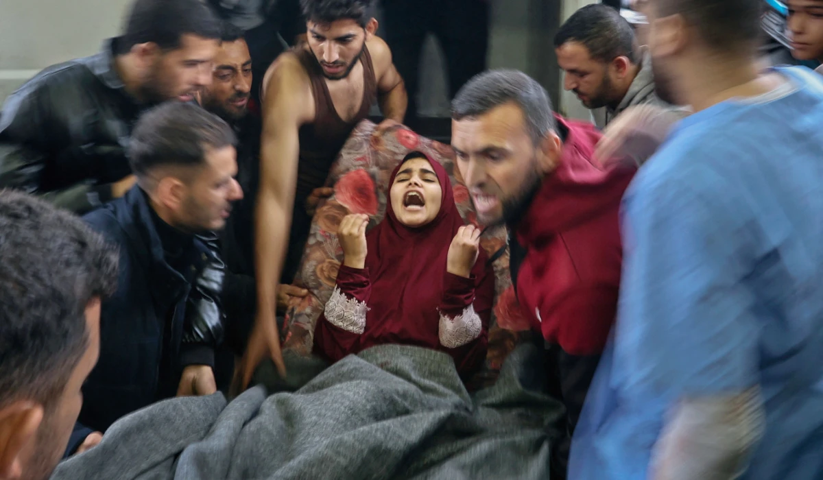 A wounded Palestinian girl screams "Ya Allah," ("Oh, my God!") as she is brought on a stretcher into Nasser hospital, following Israeli strikes on the Ma'an school, amid the conflict between Israel and Hamas, in Khan Younis, located in the southern Gaza Strip, December 5, 2023. (REUTERS)