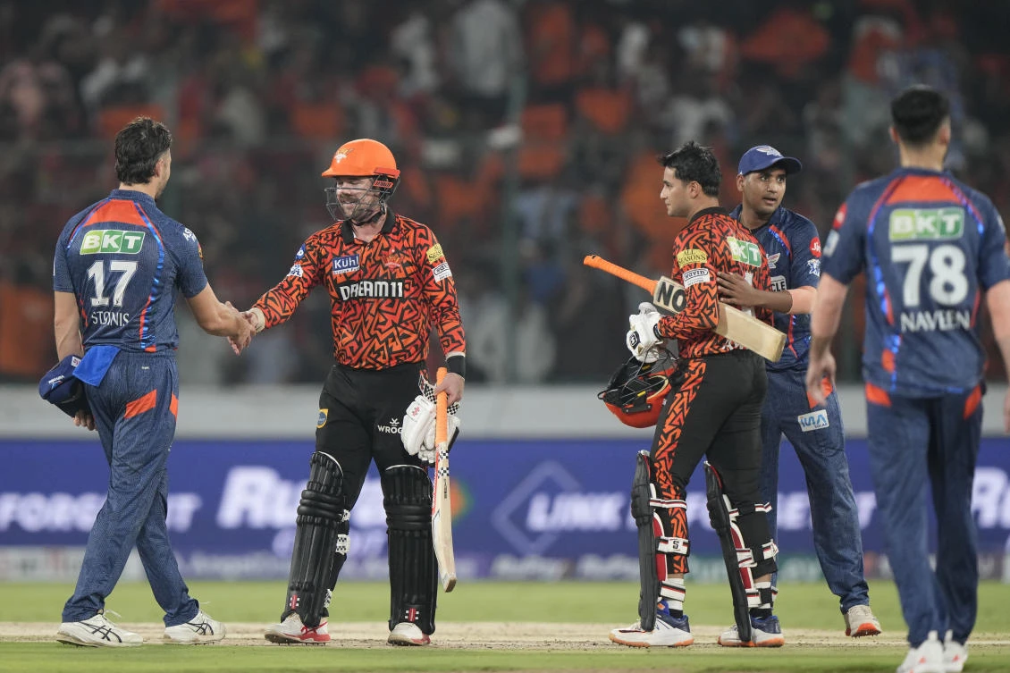 Sunrisers Hyderabad’s Travis Head, 2nd left, and Abhishek Sharma after winning the IPL cricket match against Lucknow Super Giants in Hyderabad, India, Wednesday, May 8, 2024. (AP Photo)
