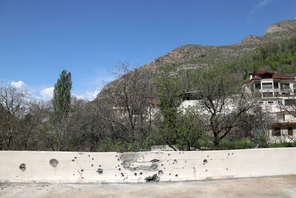 File photo shows a shrapnel-pocked walled in the village of Hiror near the Turkish border in northern Iraq's autonomous Kurdish region, where firefights occur between the Turkish army and fighters from the Kurdistan Workers' Party (PKK).(AFP)