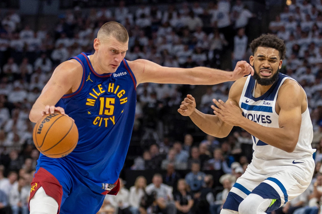 Denver Nuggets center Nikola Jokic drives to the basket past Minnesota Timberwolves center Karl-Anthony Towns in the first half during Game 3 of the second round for the 2024 NBA playoffs at Target Center. (USA TODAY Sports)